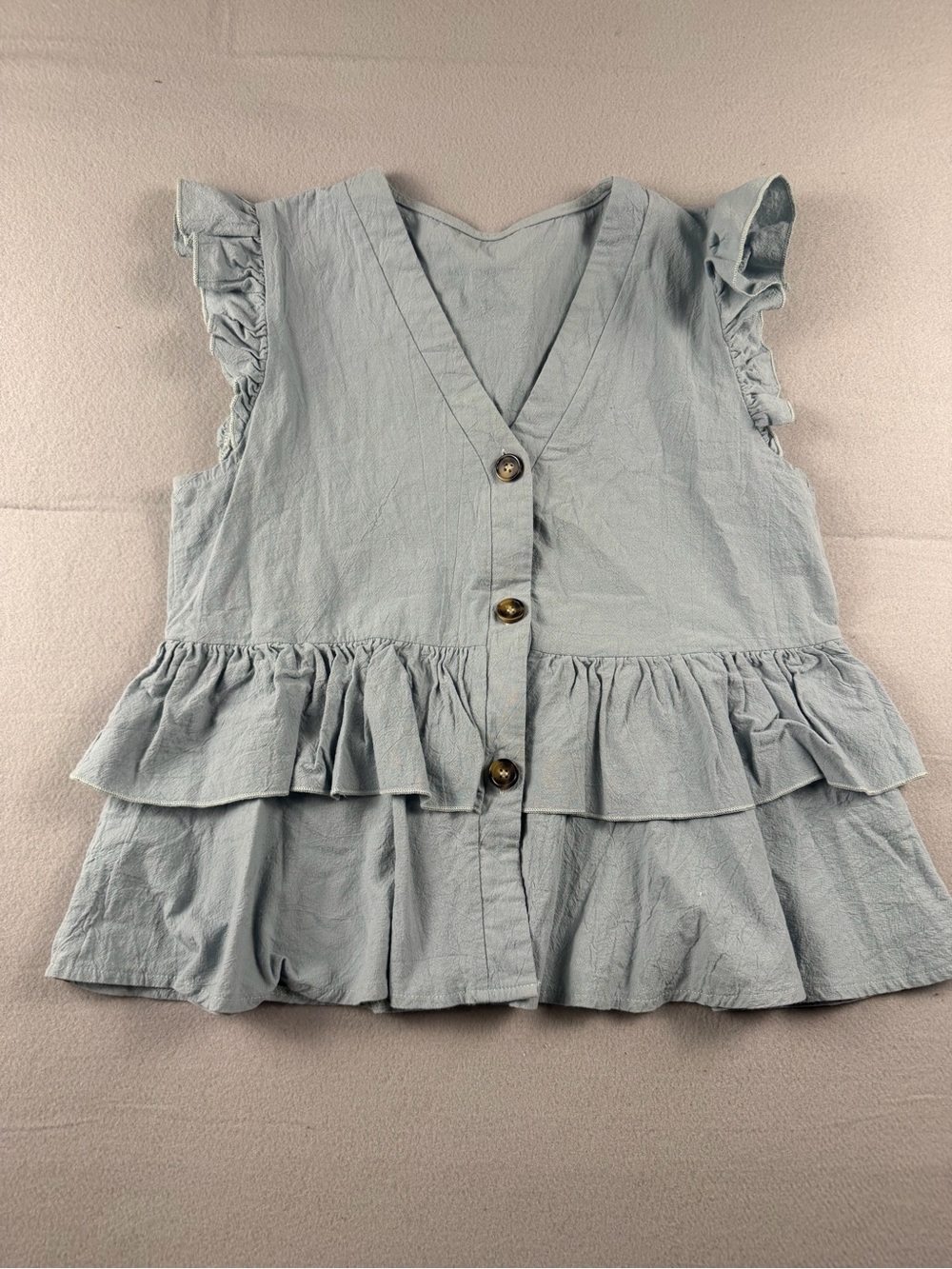 Sleeveless Light Blue Ruffle Button-Front V-Neck Blouse